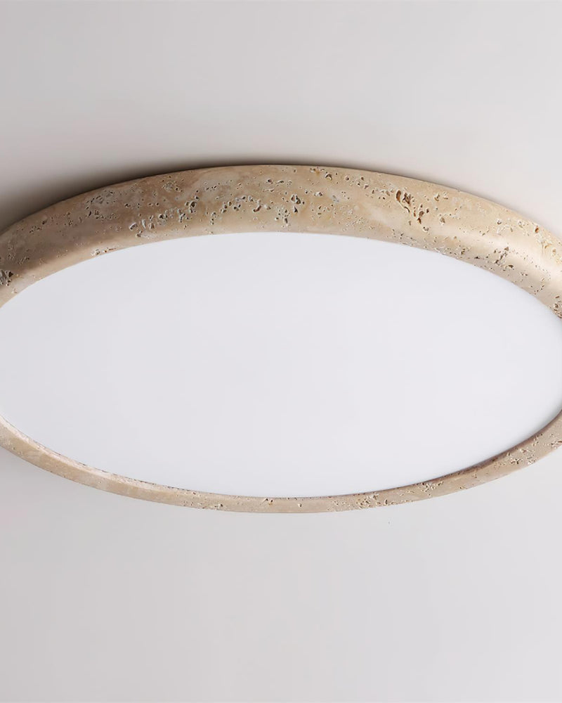 Close-up of the LUNA No.05 travertine flush mount ceiling light rim with the white diffuser switched off