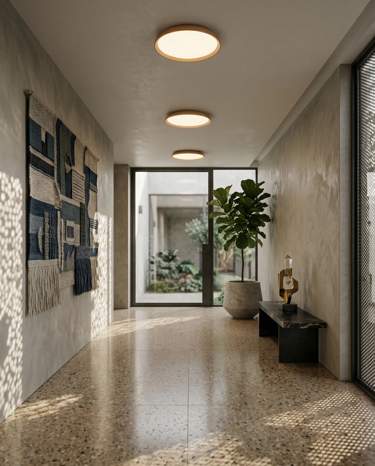 Travertine flush mount ceiling light LUNA No.01, two lit units along a hallway with a terrazzo floor and a glass door