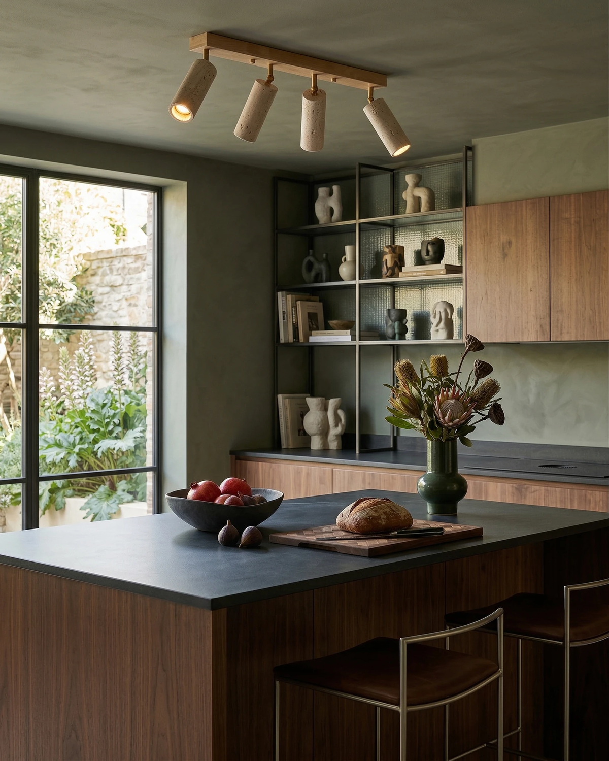 Travertine flush mount ceiling light PIETRA No.04 with four spots angled over a dark stone kitchen island, one lit