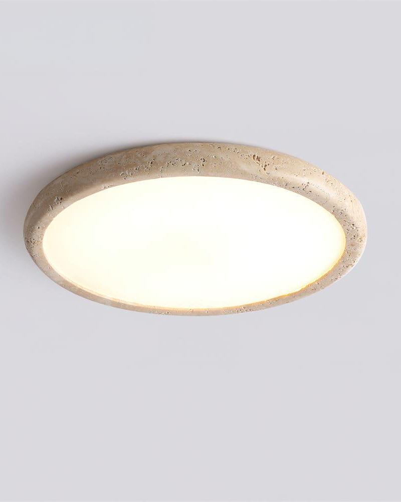 Travertine flush mount ceiling light LUNA No.05, large size, cream travertine disc switched on, angled view