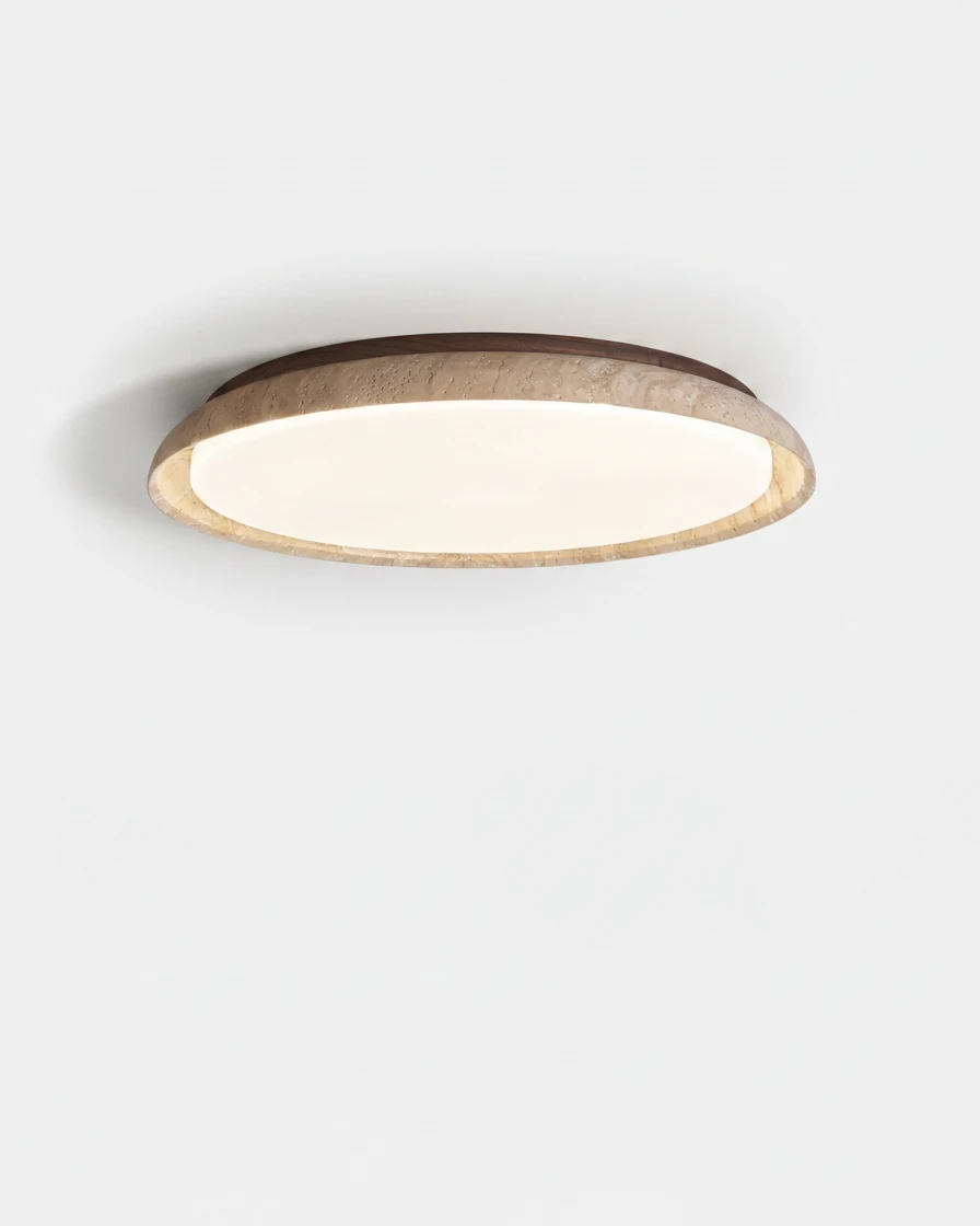 Travertine flush mount ceiling light LUNA No.01 in the small 30 cm size, slim stone rim around a lit diffuser