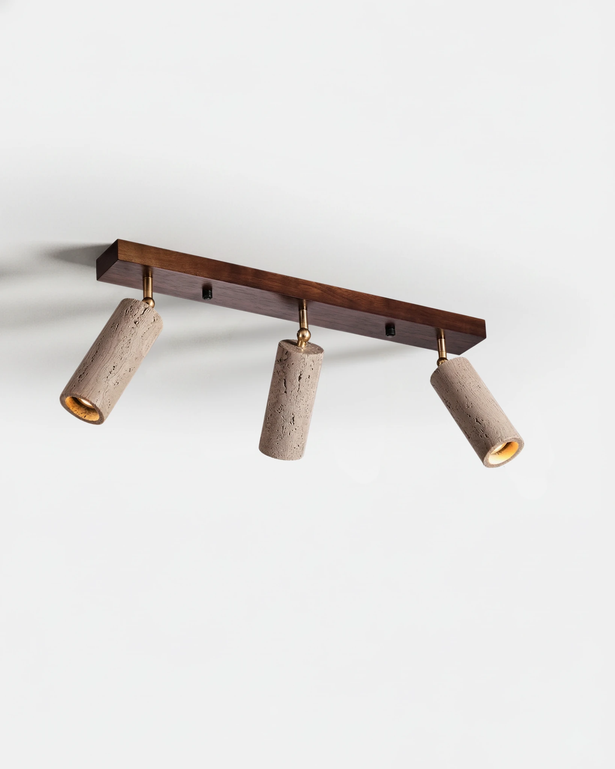 Travertine flush mount ceiling light PIETRA No.04 in Triple Walnut, three travertine spots on a walnut bar, unlit