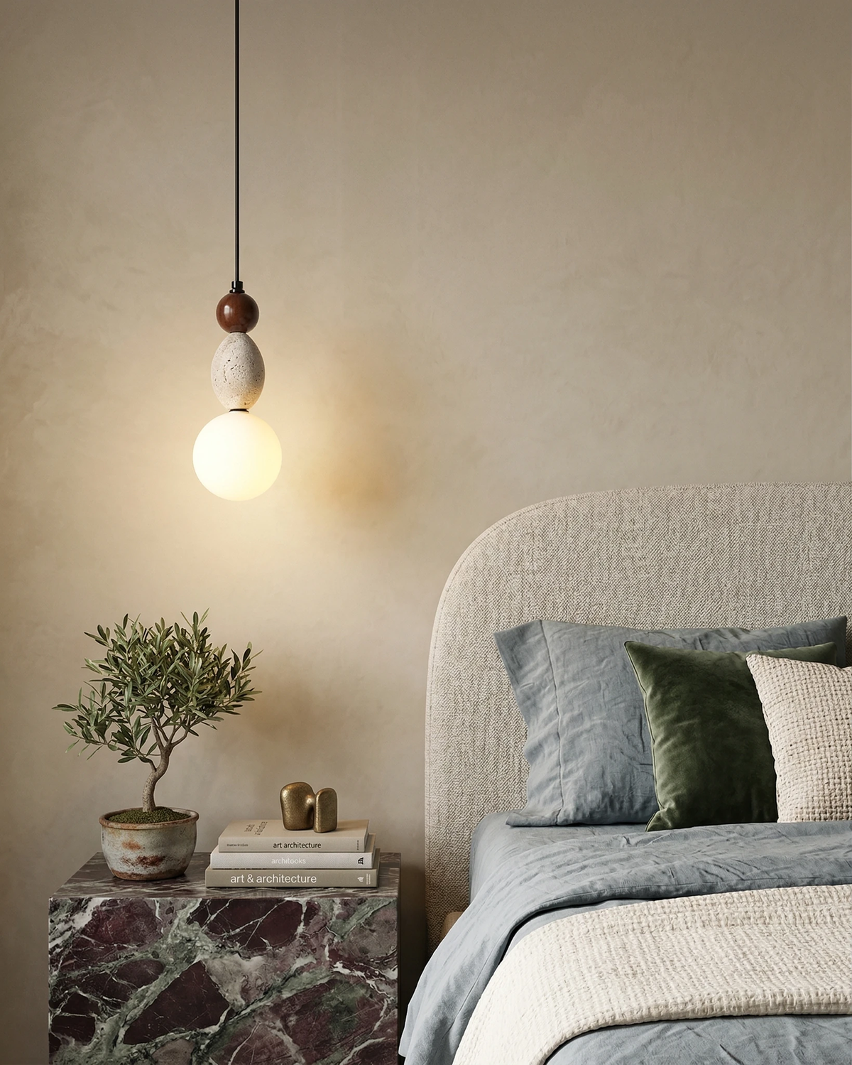 Travertine pendant light DOMUS No.04 switched on beside a boucle headboard above a red marble nightstand