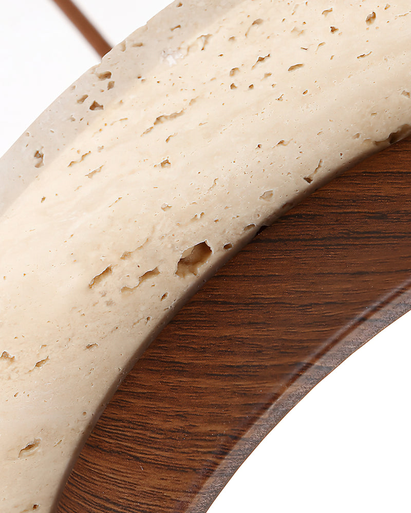Close-up of the travertine disc edge and walnut underside ring of the SOVA No.02 travertine pendant light