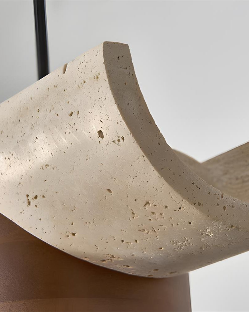 Close-up of the pitted cream travertine bar end and walnut cone of the PIETRA No.06 travertine pendant light