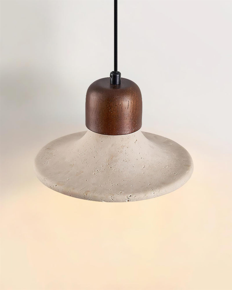 Travertine pendant light SOVA No.03 single, wide flared shade glowing beneath, seen from slightly below