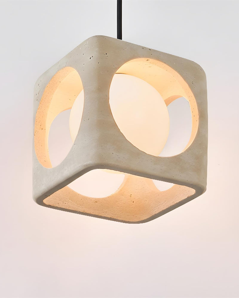 Travertine pendant light CUBA No.02 seen from below with the lit opal sphere visible through the cube openings