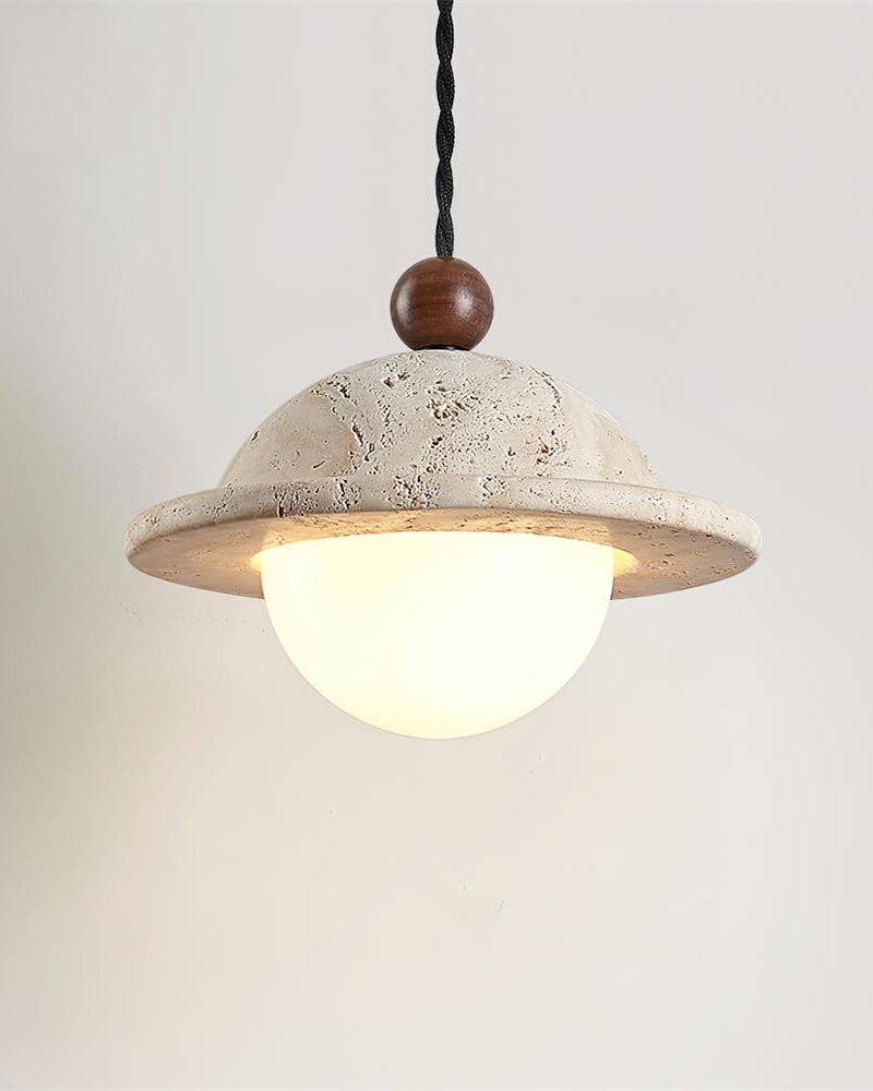Travertine pendant light SOVA No.01 seen from below, lit opal globe under the travertine rim on a twisted black cord