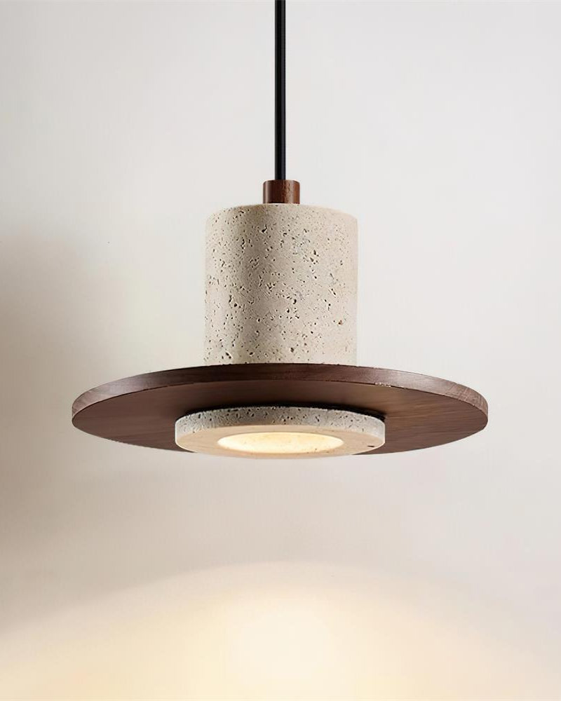 Travertine pendant light TONDO No.04 seen straight on, speckled cream drum over a walnut disc with a glowing lens