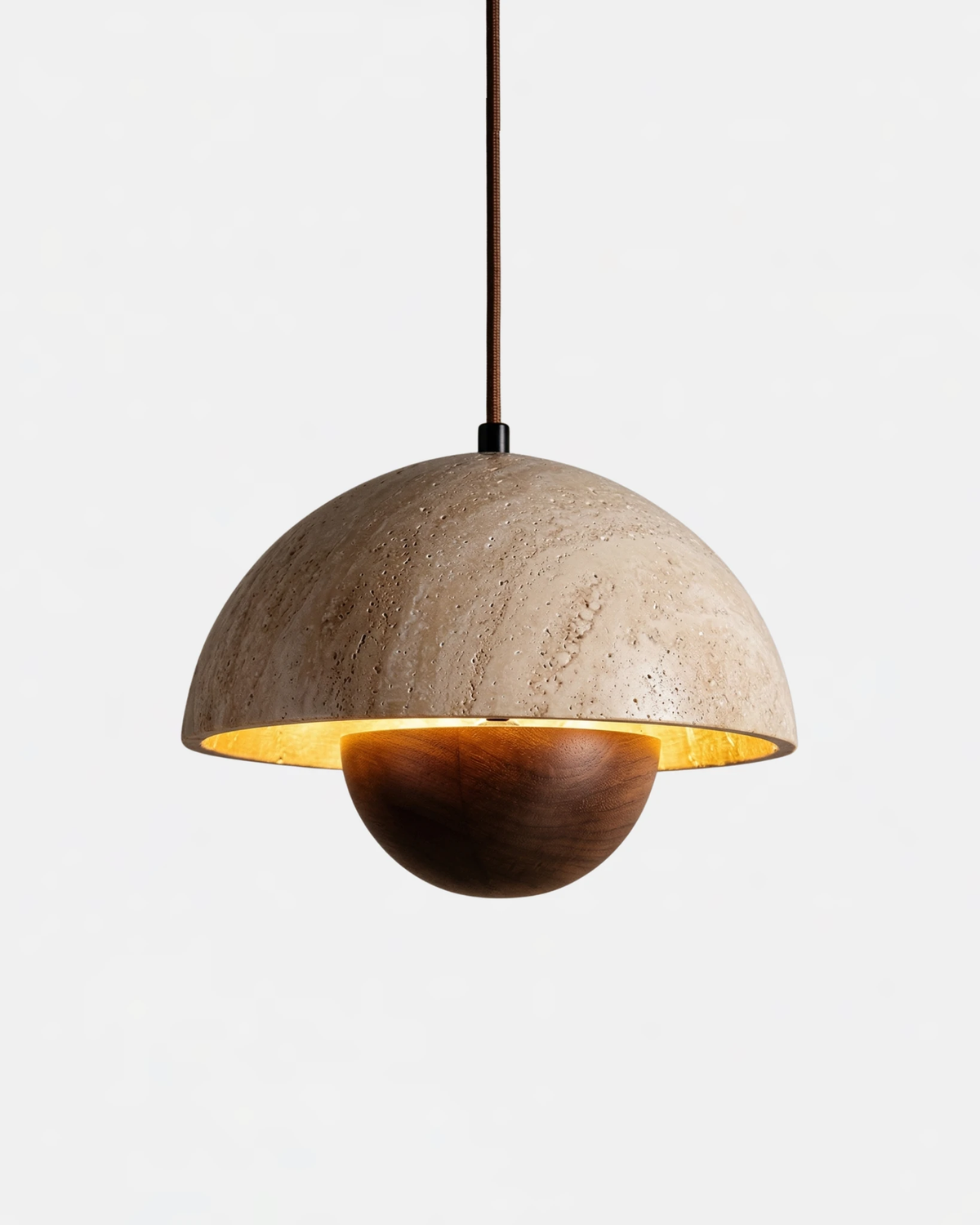 Travertine pendant light SOLE No.01 with walnut sphere, dome switched on and glowing on a white background