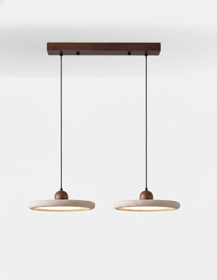 Two travertine pendant lights TONDO No.02 in the double cluster, lit discs hung from one walnut canopy bar