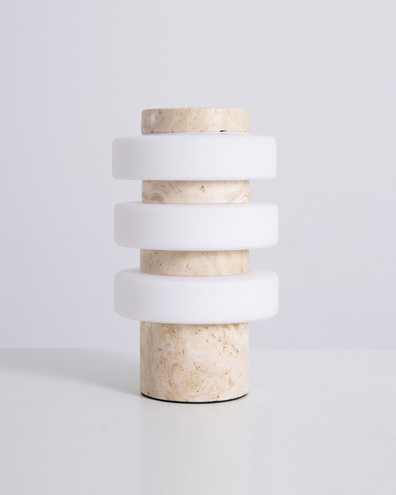 Travertine table lamp PIETRA No.05 cream travertine stacked column with three matte white rings, unlit