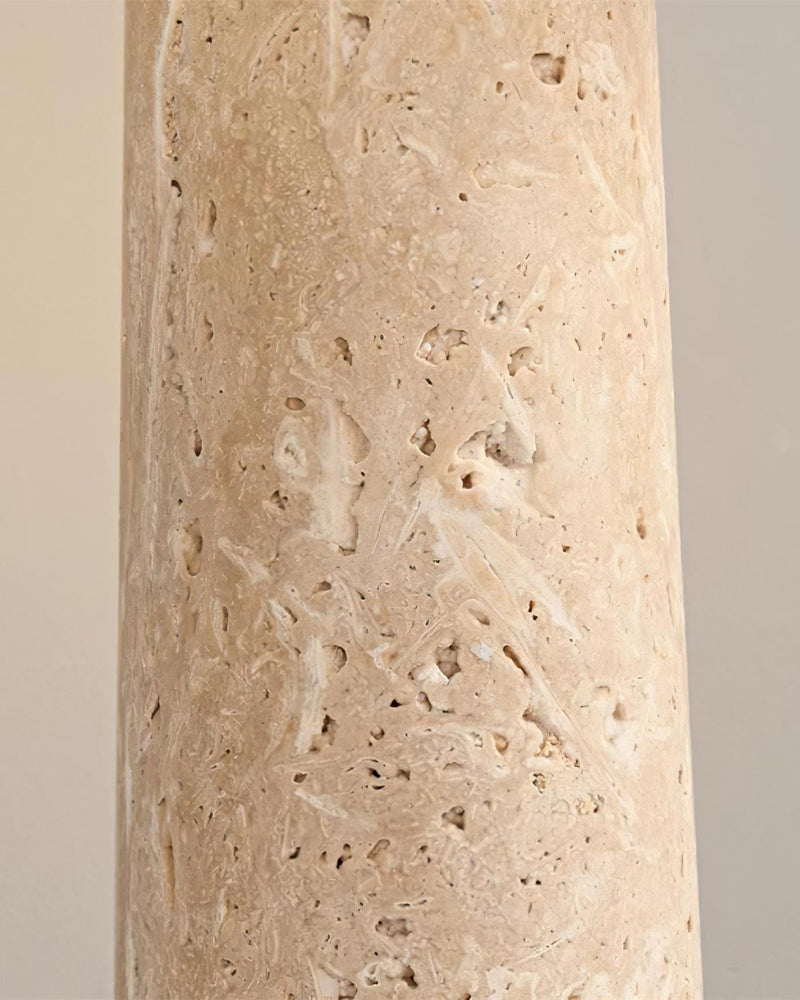 Close-up of the pitted beige travertine column of the MORA No.03 travertine table lamp