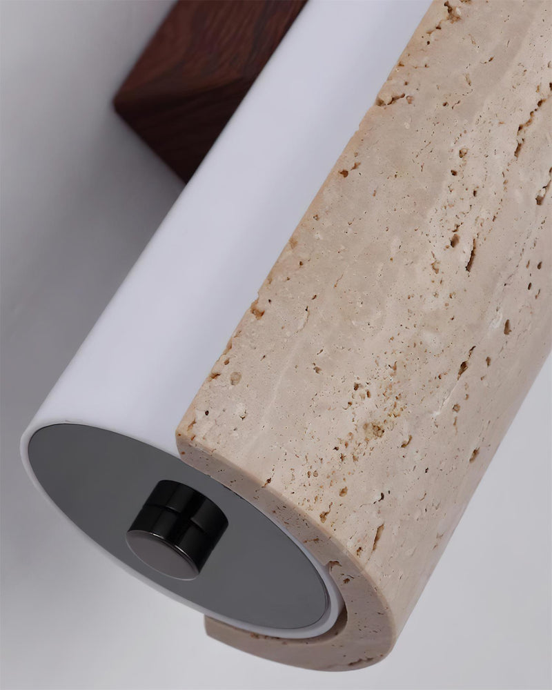 Close-up of the end of the NOTTI No.01 travertine vanity light, travertine tube with opal insert and black cap