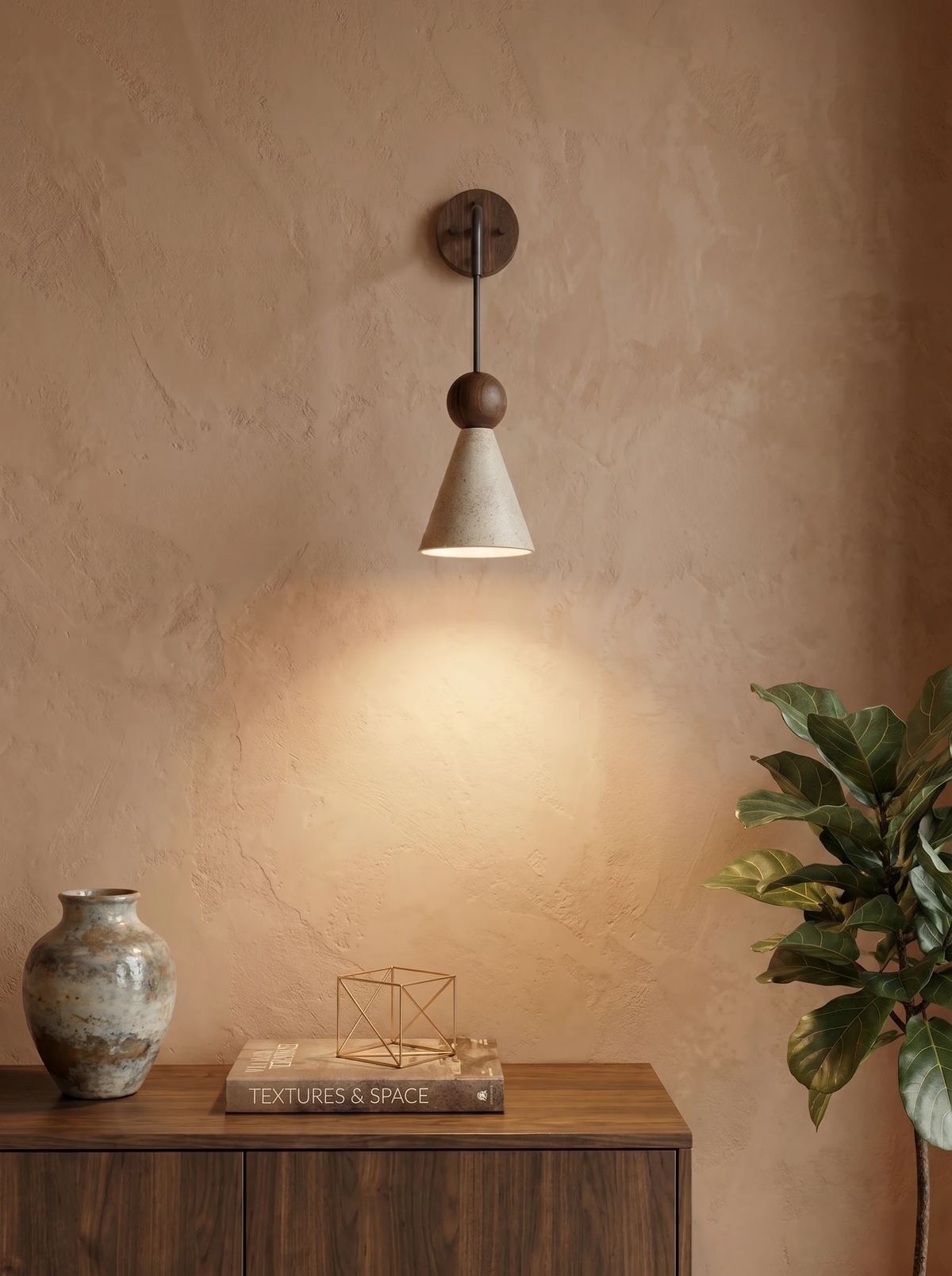 Travertine wall sconce CORTO No.01, cone shade with a walnut ball lit on a plaster wall above a walnut sideboard