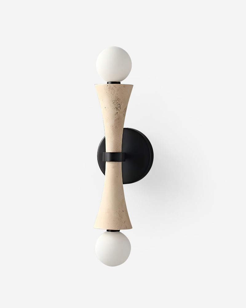 Travertine wall sconce VETTA No.01 in cream travertine, hourglass body with twin opal globes on a black backplate