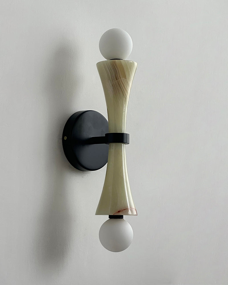 Travertine wall sconce VETTA No.01 in green jade, veined stone hourglass with twin white globes on a black mount