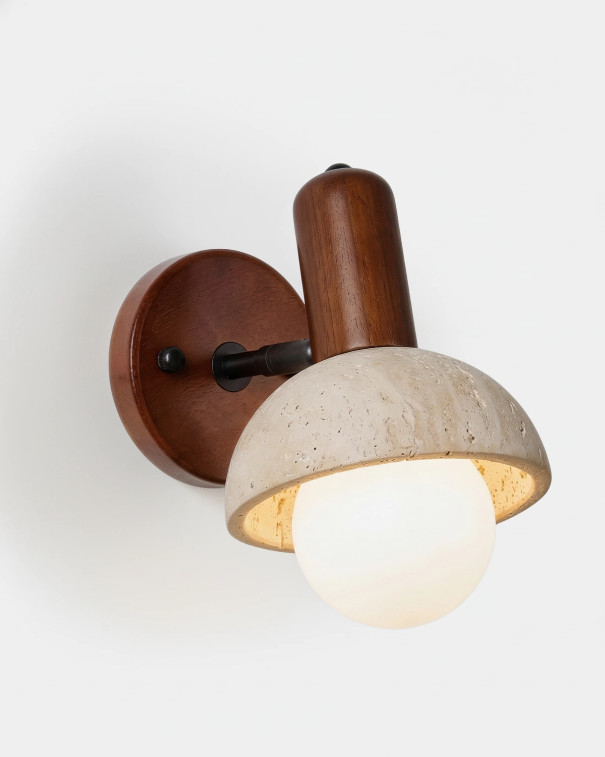 Travertine wall sconce CONA No.01, dome head with opal globe on a dark walnut backplate, globe lit
