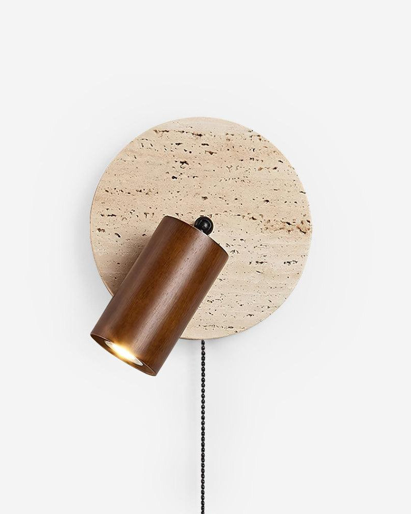 Travertine wall sconce VITRU No.03 in Dark Walnut, round stone disc with a pivoting walnut spotlight and pull chain, on