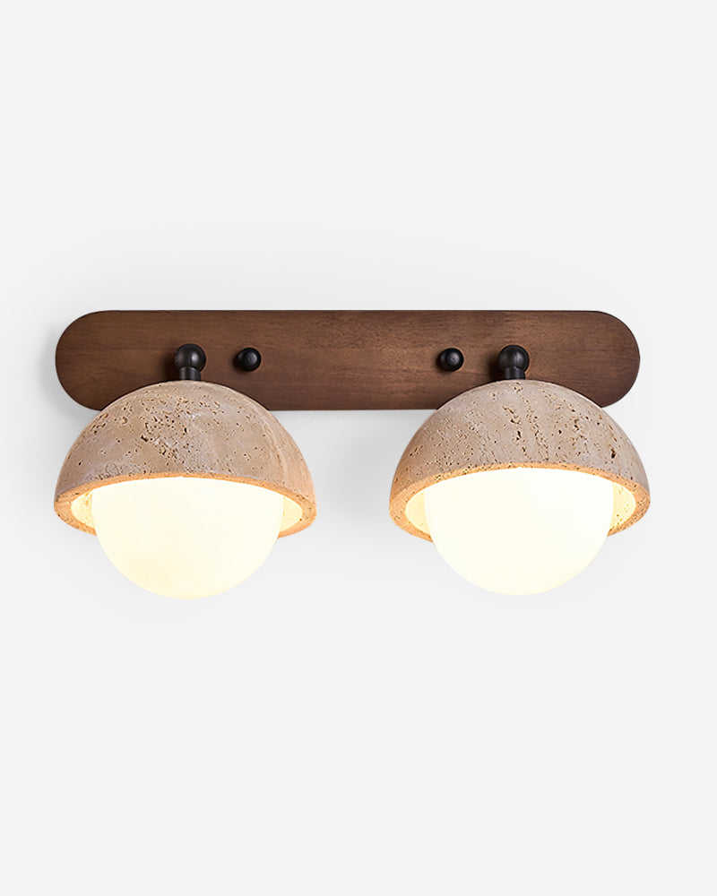 Travertine wall sconce AURA No.02 Double Globe in Beige Travertine, two stone domes over glowing glass on a walnut bar