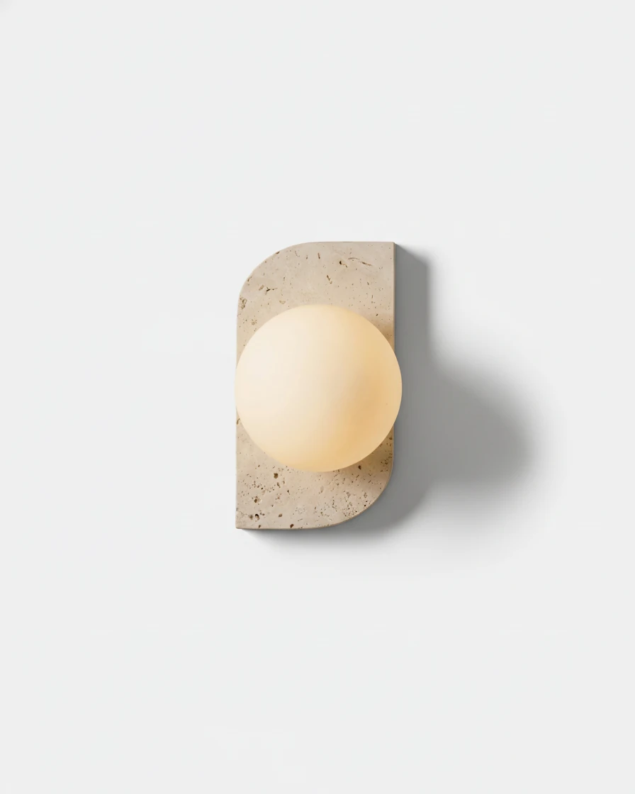 Travertine wall sconce PRATO No.03 single globe, one opal globe switched on against a travertine backplate