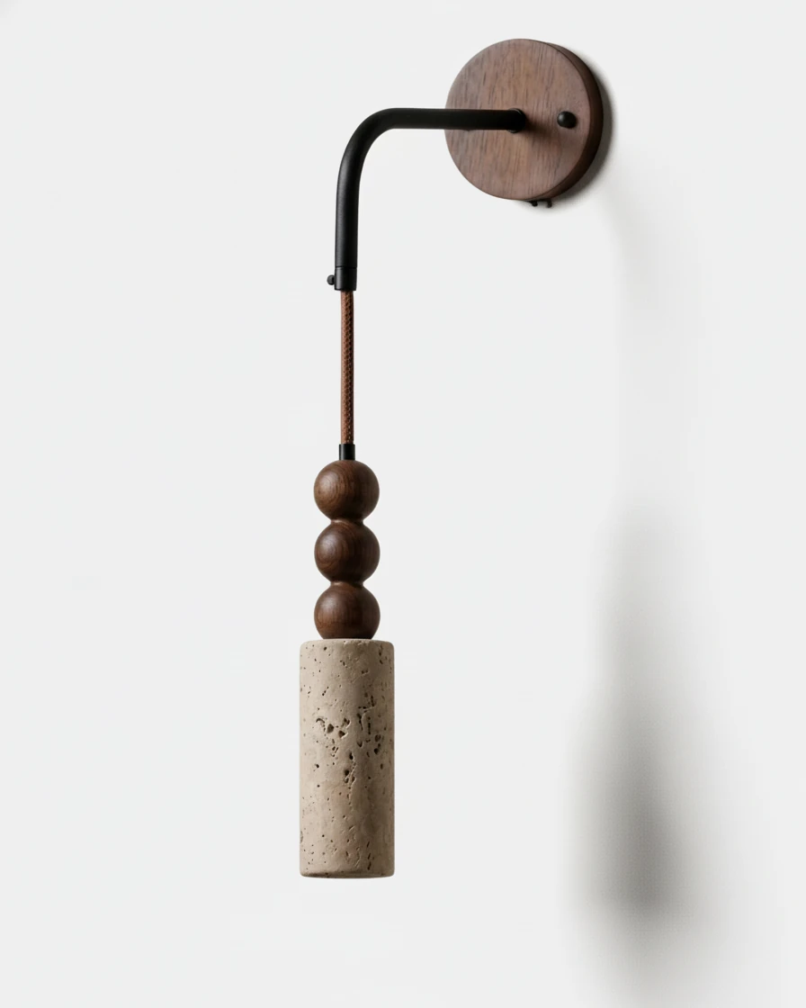 Travertine wall sconce ARGO No.01 Perle, stacked walnut beads over a travertine cylinder hung from a black arm, unlit