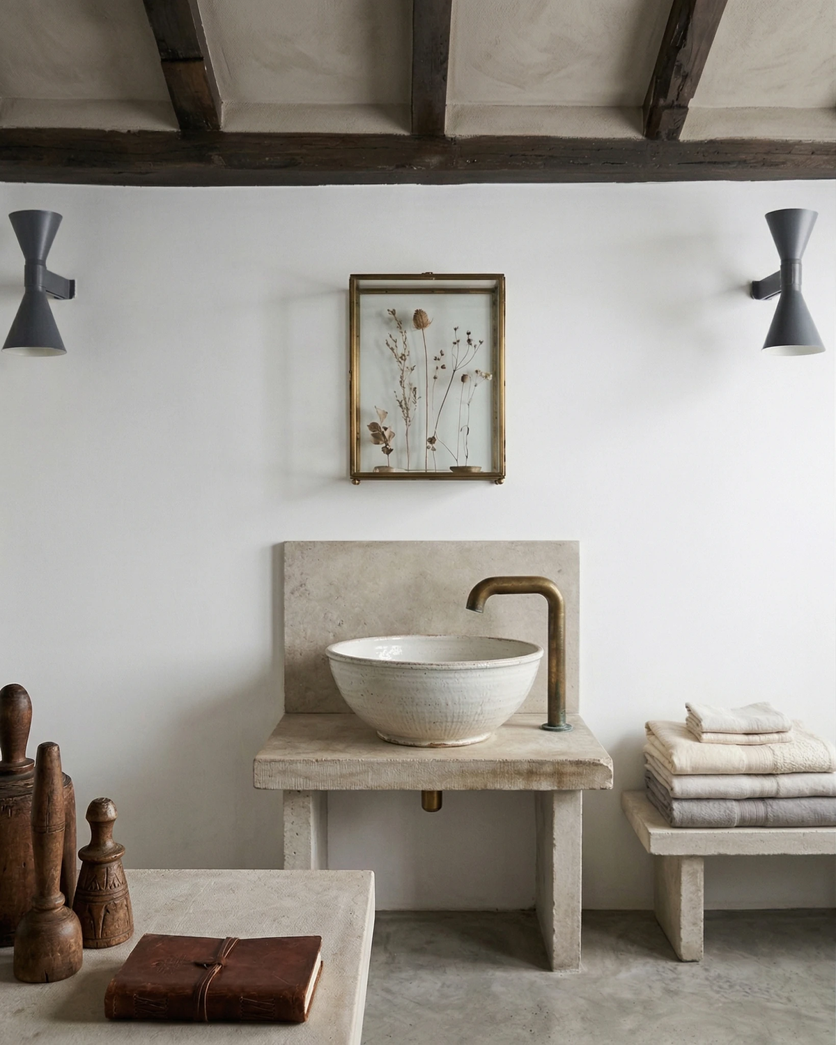 Up down wall sconce ECLISSI No.01, two dark units on a white wall in a beamed bathroom with a stone washstand and bowl sink