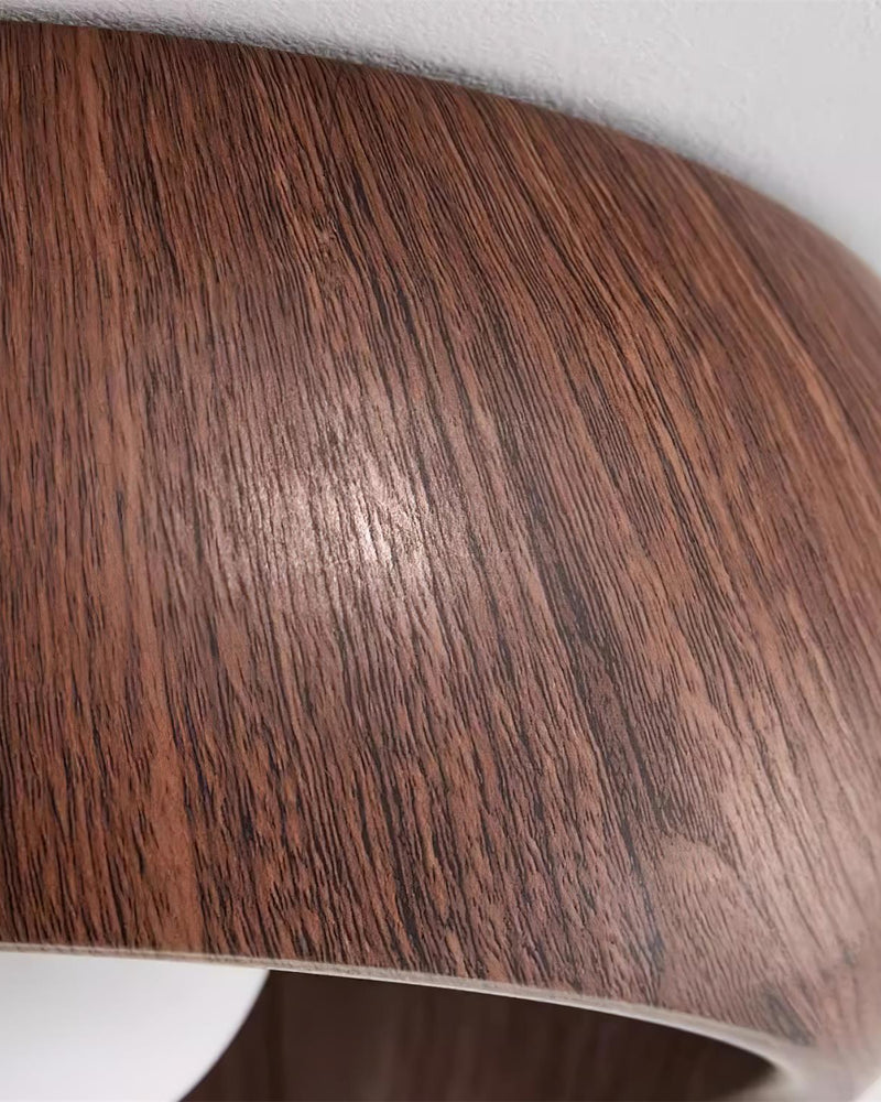 Close-up of the dark walnut wood grain on the dome of the OMBRA No.01 wood flush mount ceiling light