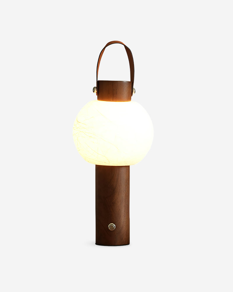 Wood table lamp NAPOLI No.01 in Walnut, portable lantern with a white globe diffuser and leather strap handle, unlit