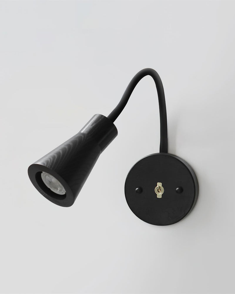 Wood wall sconce RIGA No.07 in blackened oak, cone spot head and black gooseneck on a dark round backplate
