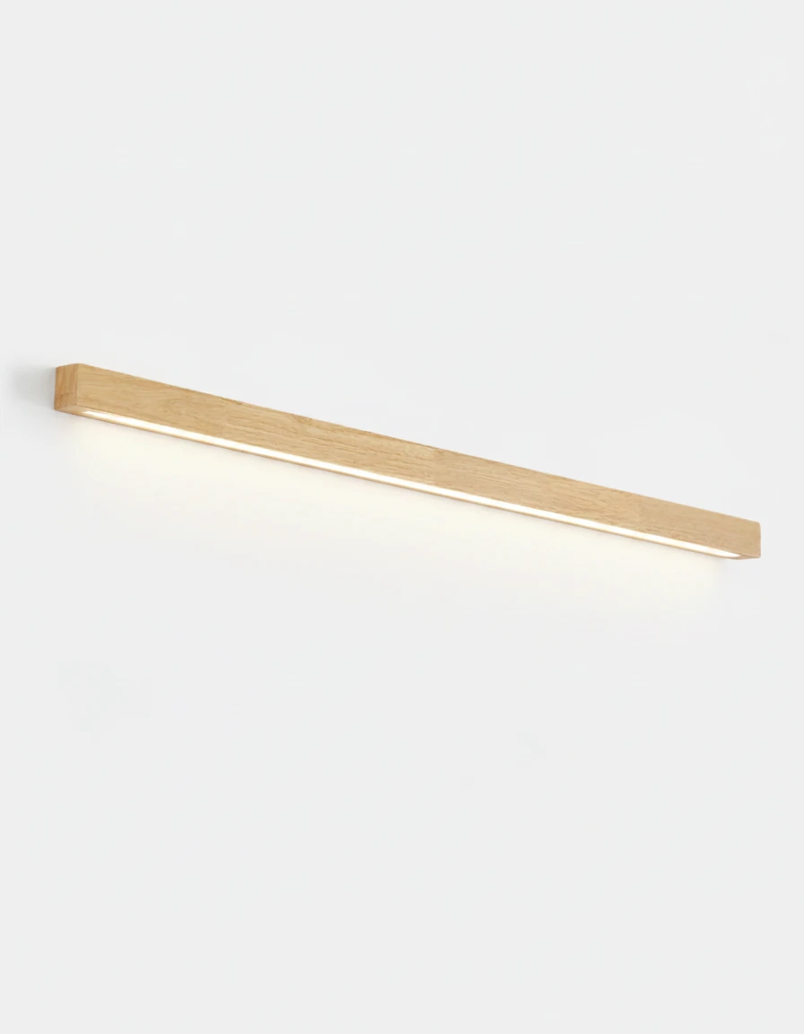 Wood wall sconce PIANO No.01 in light walnut, 100 cm linear bar lit and throwing light down the wall