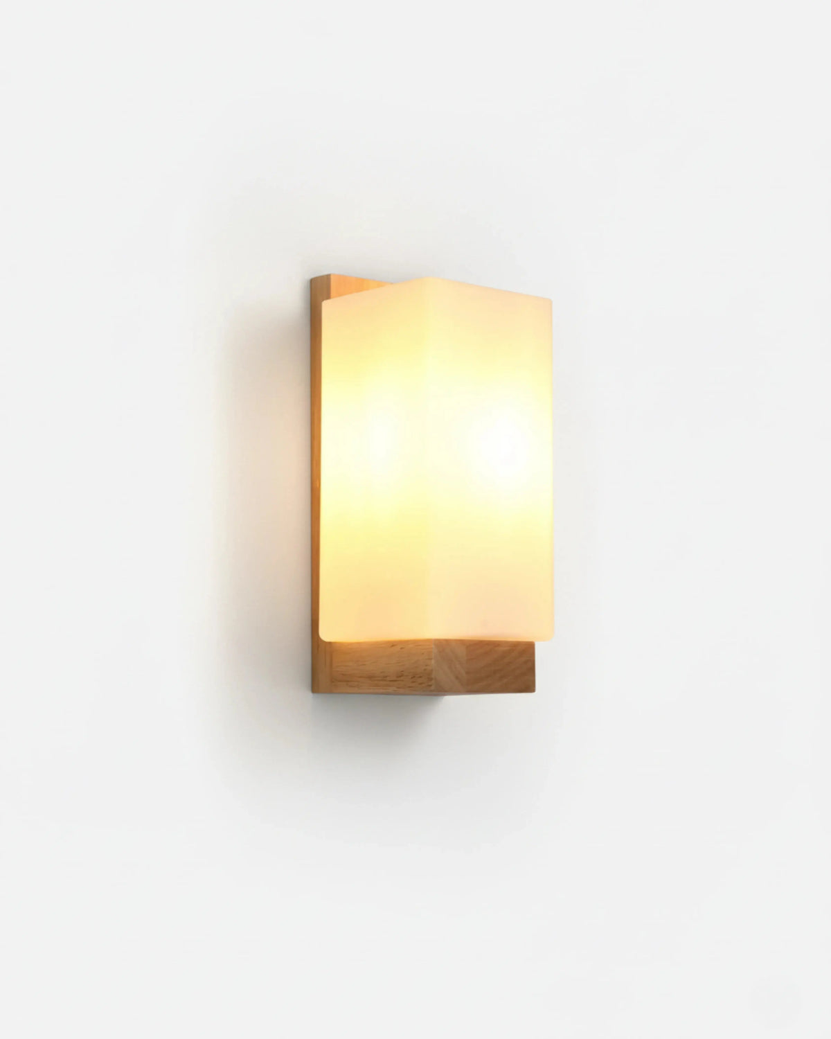 Wood wall sconce MURO No.01 in Natural Oak, rectangular oak block with a glowing opal panel