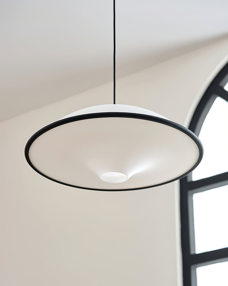 Acrylic pendant light AOSTA No.01 with black rim, unlit white saucer seen from below beside an arched window