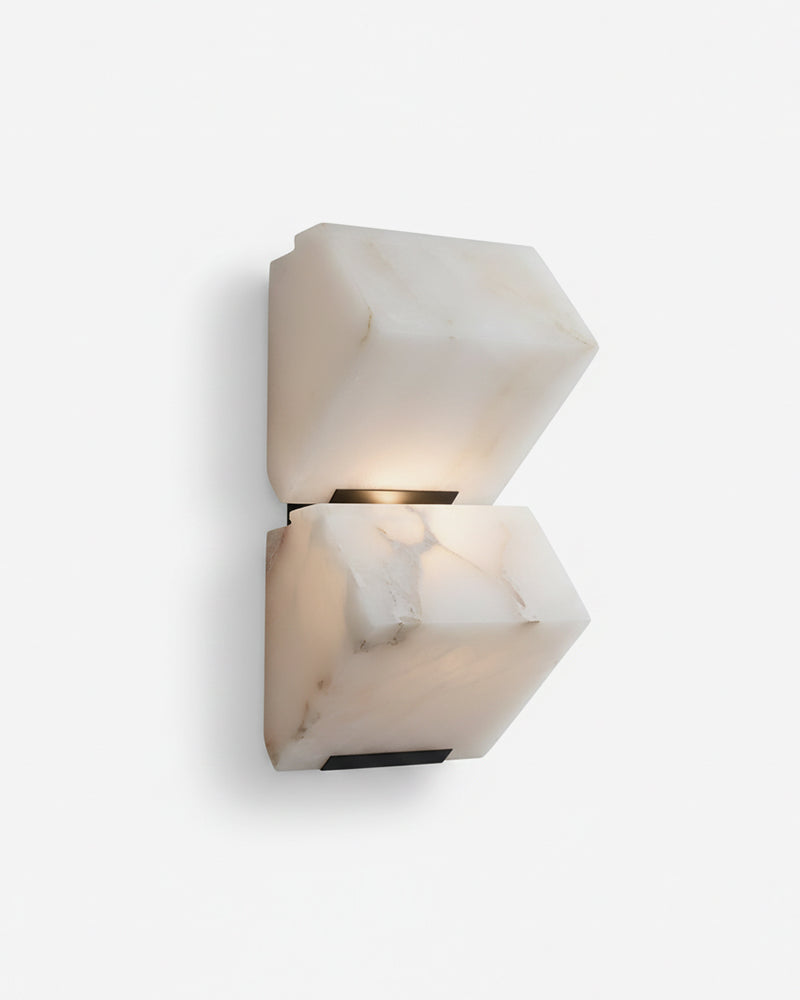 Alabaster wall sconce ALABA No.05 duo, two faceted alabaster blocks stacked on a black spine, switched on
