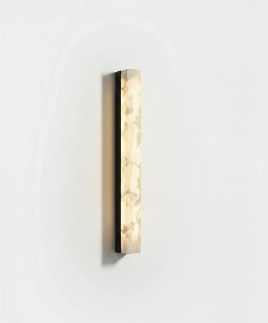 Alabaster wall sconce NEBBIA No.02, 24 in column on a Volcano Black bar, switched on against a plain white wall
