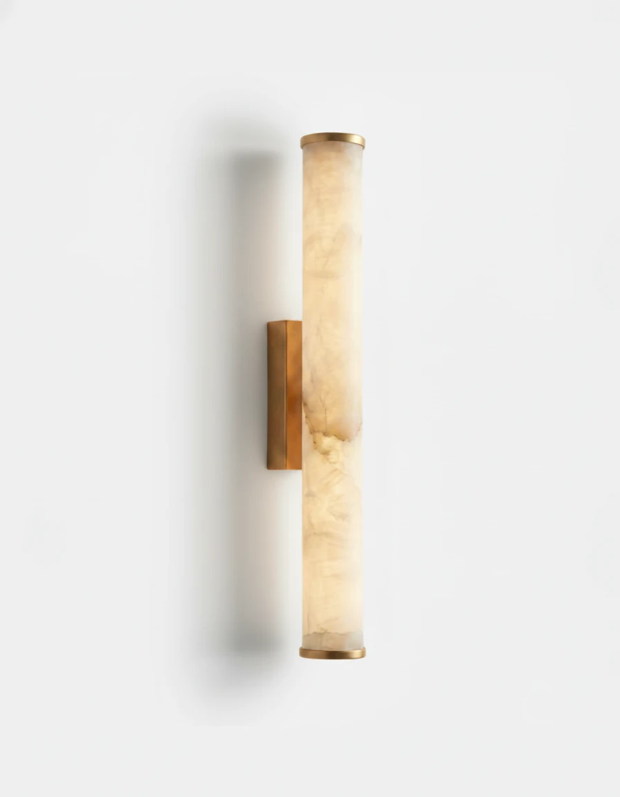 Alabaster wall sconce NEBBIA No.01, 24 in tube on a Warm Gold bracket, switched on, angled view on white