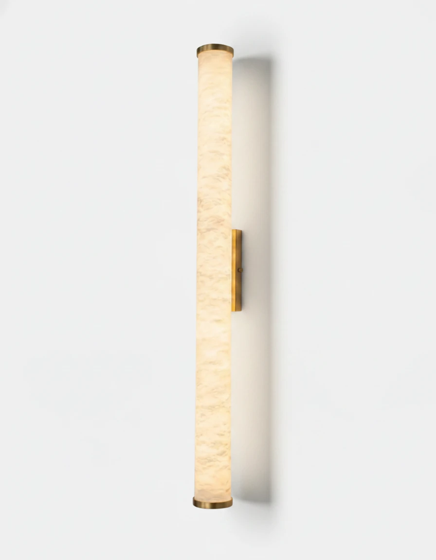 Alabaster wall sconce NEBBIA No.01, 31 in tube on a Warm Gold bracket, lit, tall front view on a white wall