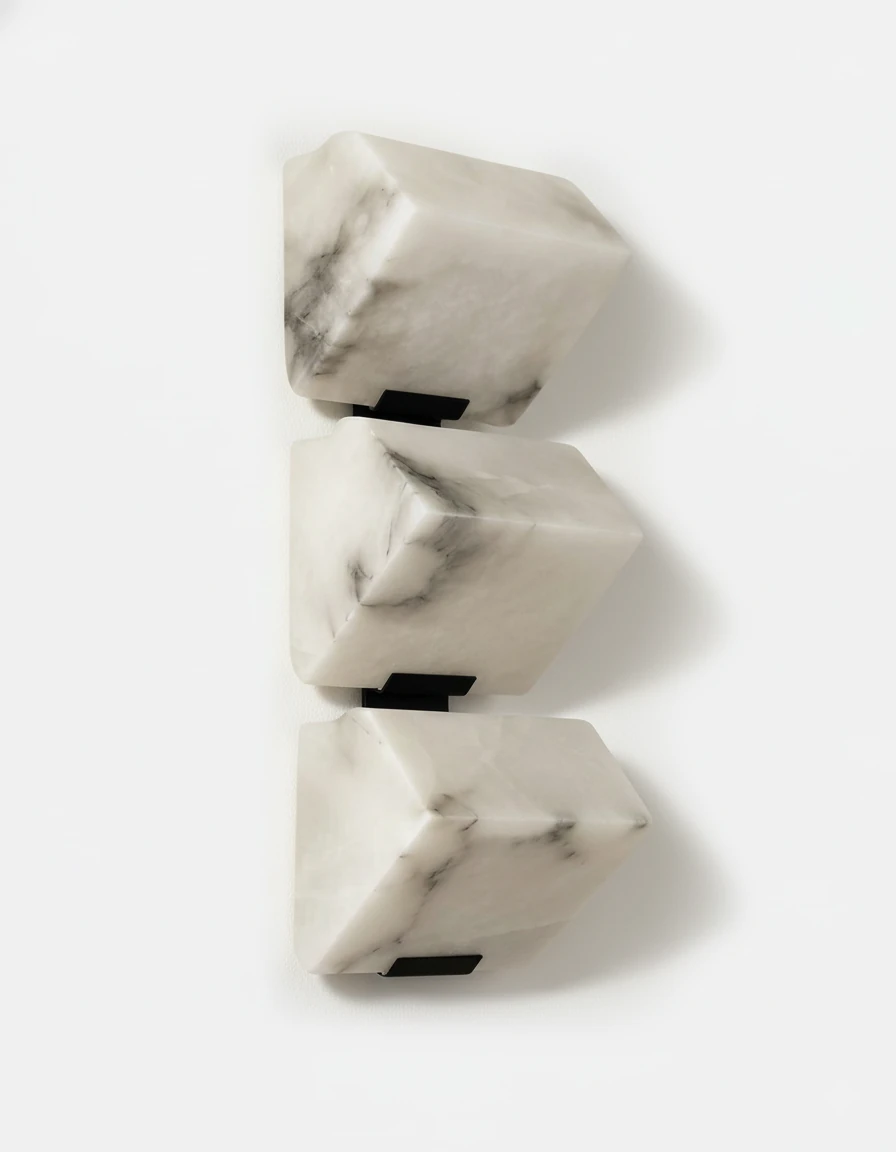Alabaster wall sconce ALABA No.05 trio, three faceted alabaster blocks stacked on black brackets, unlit