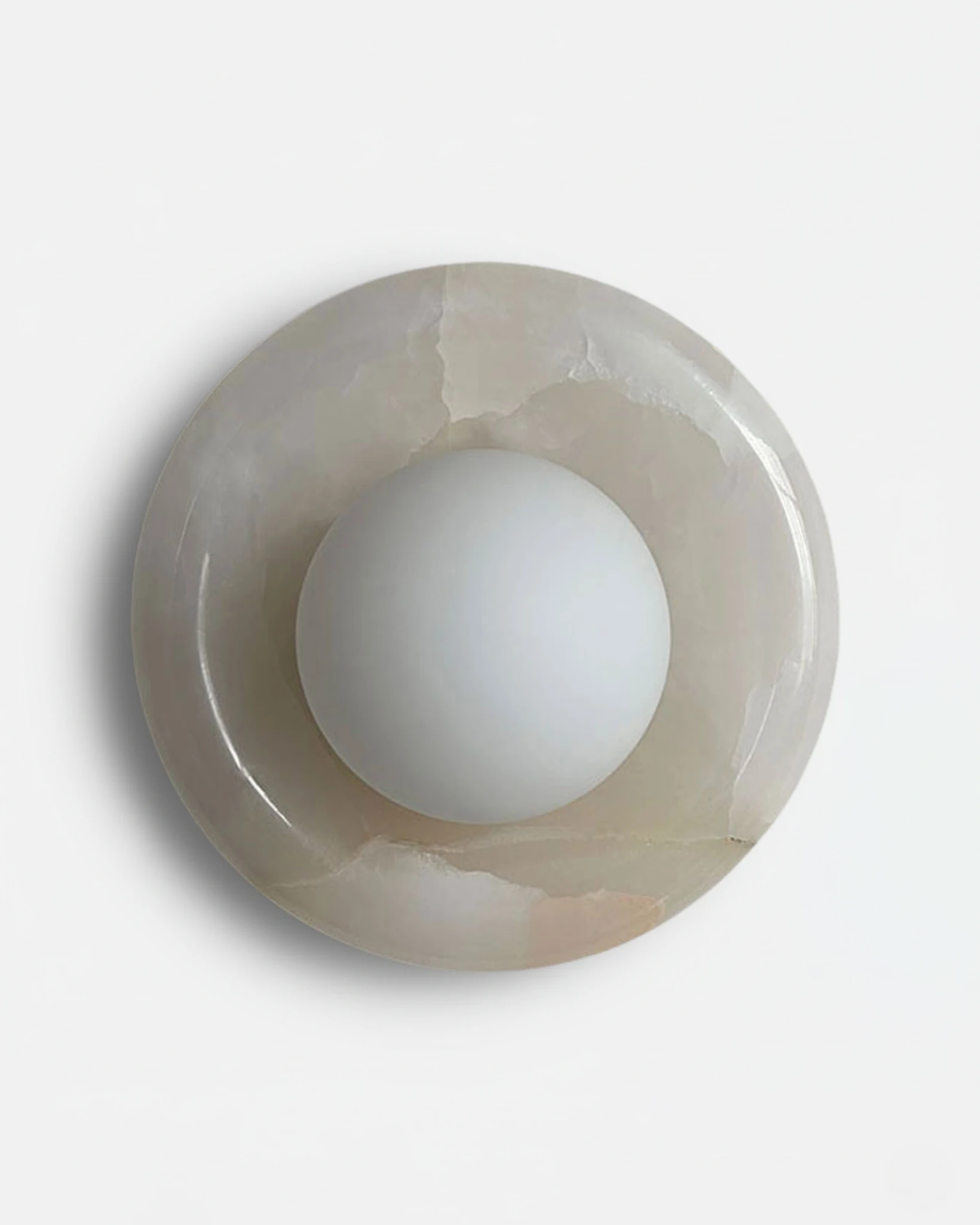 Alabaster wall sconce LATTE No.02 in White Jade, pale translucent stone ring with a frosted glass sphere, unlit