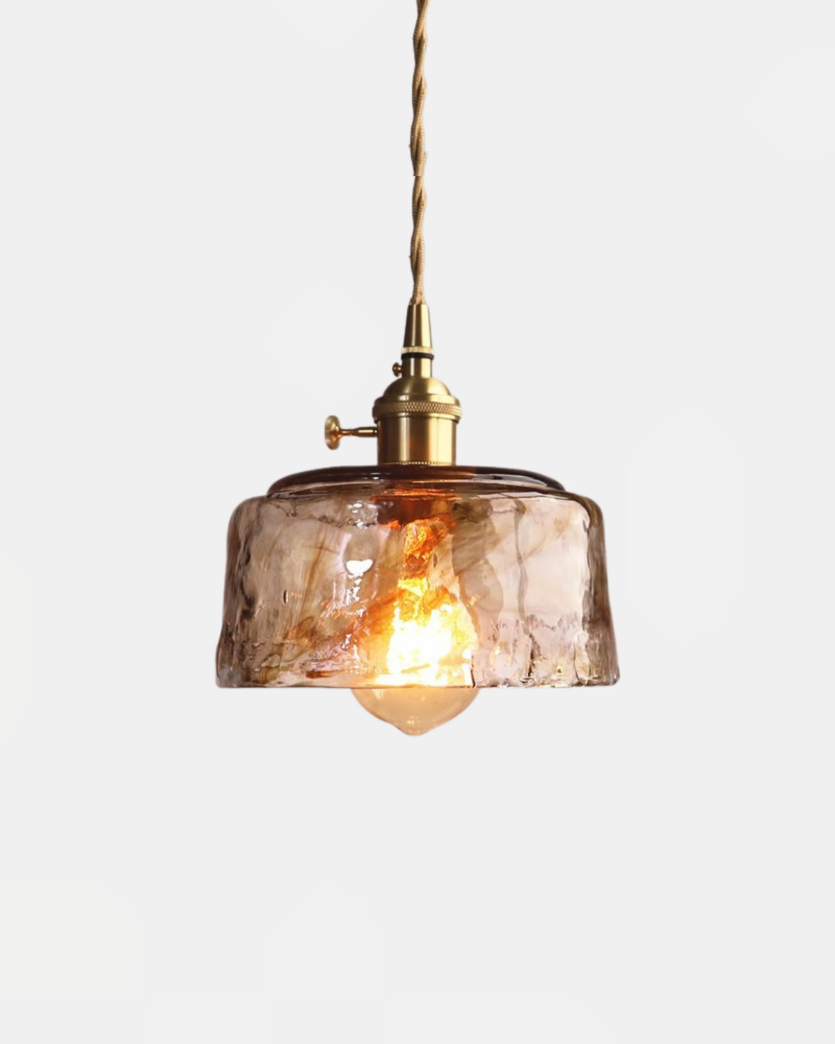 Amber glass pendant light OVIA No.05 in the Dome shape, marbled pressed glass with a glowing filament bulb and brass socket