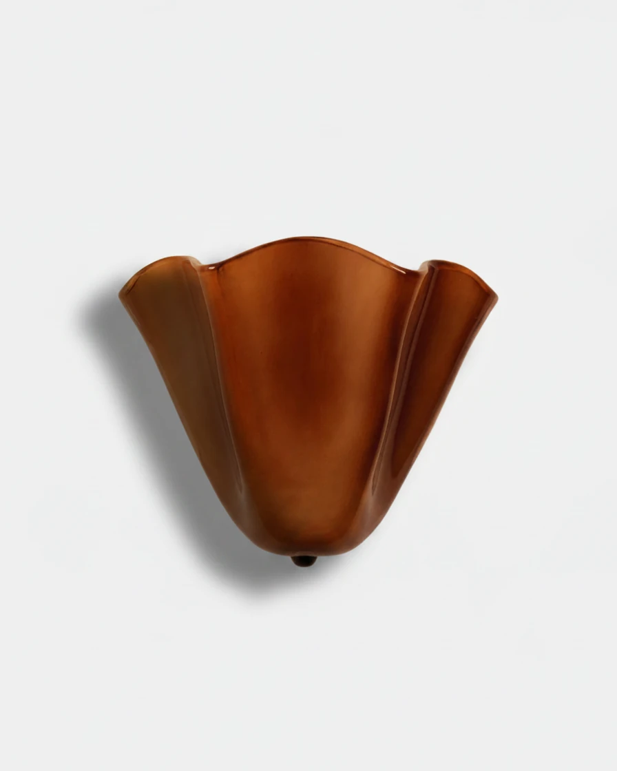 Brass wall sconce DALIA No.03 in amber brown, glossy petal-shaped glass shade seen unlit from the front