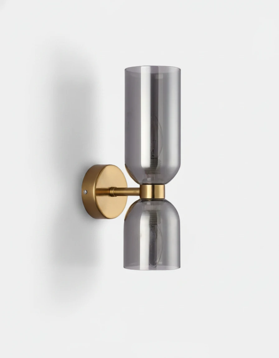 Brass wall sconce DALIA No.01 in Antique Brass with Smoked Glass, gray twin cylinders on a brass backplate, unlit