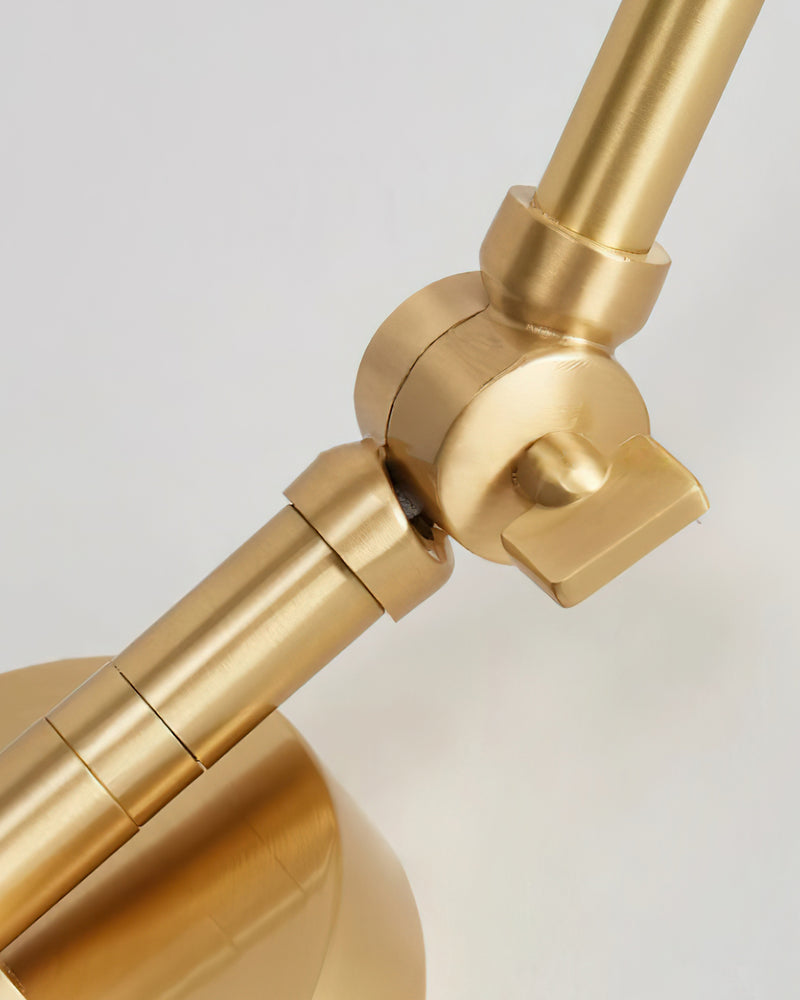 Close-up of the brass swivel joint on the arm of the DALIA No.04 brass wall sconce