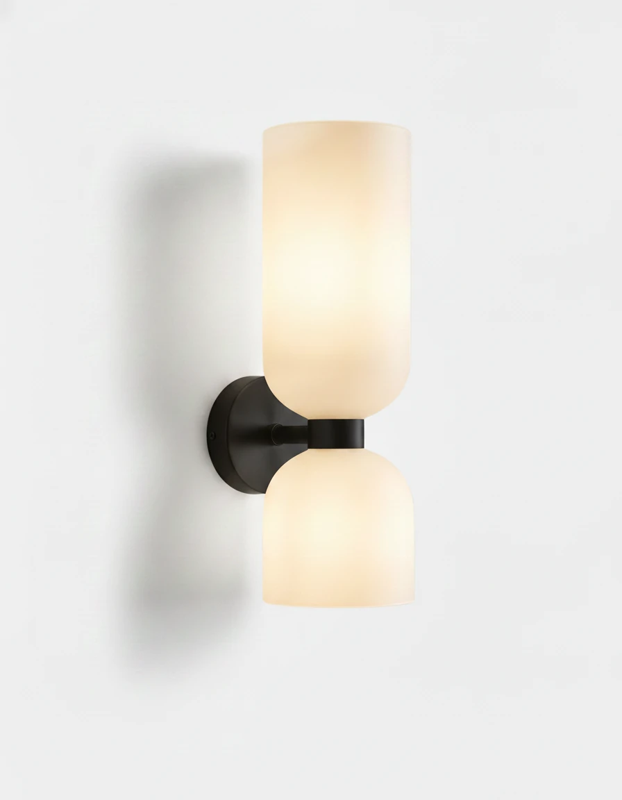 Brass wall sconce DALIA No.01 in Matte Black with Opal Glass, twin white shades lit on a black backplate