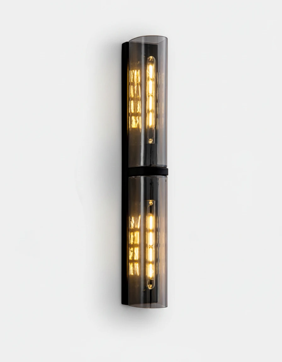 Brass wall sconce PILA No.01 Tall Stacked, two smoked glass shields stacked on a matte black frame, lit