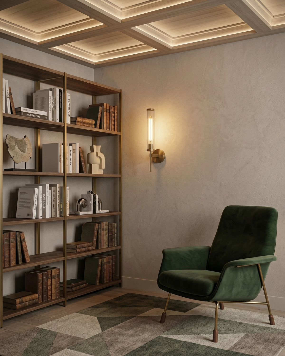 Brass wall sconce ROMA No.01 lit on a plaster wall beside a library shelf and a green velvet chair