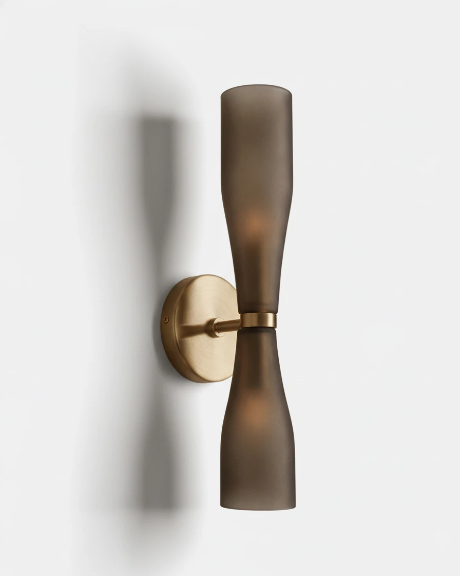 Brass wall sconce DALIA No.02 in Smoked Gray, tinted hourglass glass on a brushed brass backplate, unlit