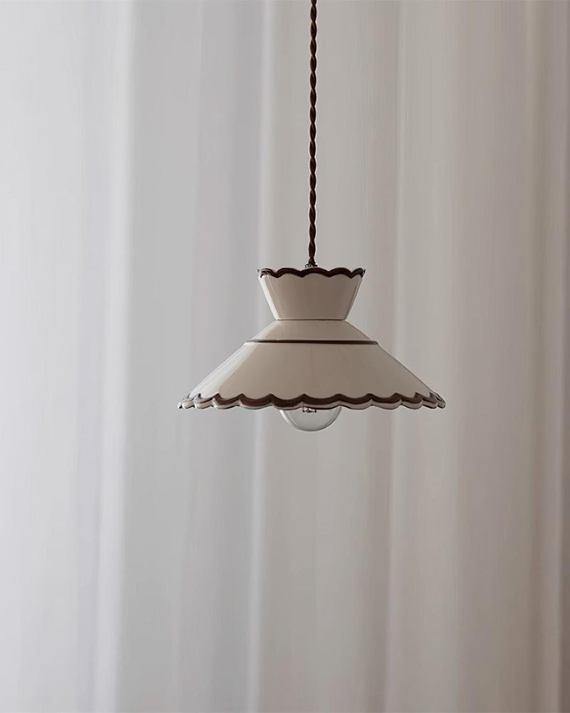 Ceramic pendant light MELI No.04 with pleated cream white shade hanging in front of white curtains