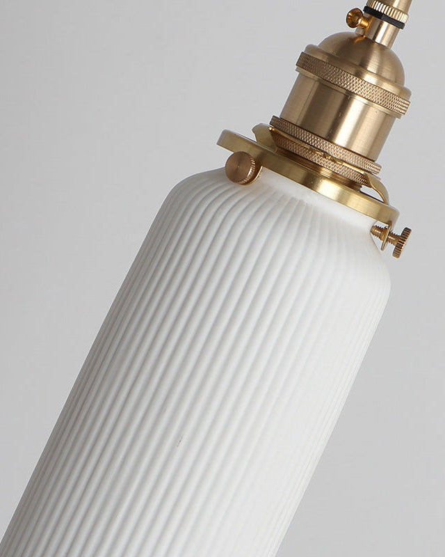 Close-up of the brass socket and ribbed white top of the SERA No.01 ceramic pendant light