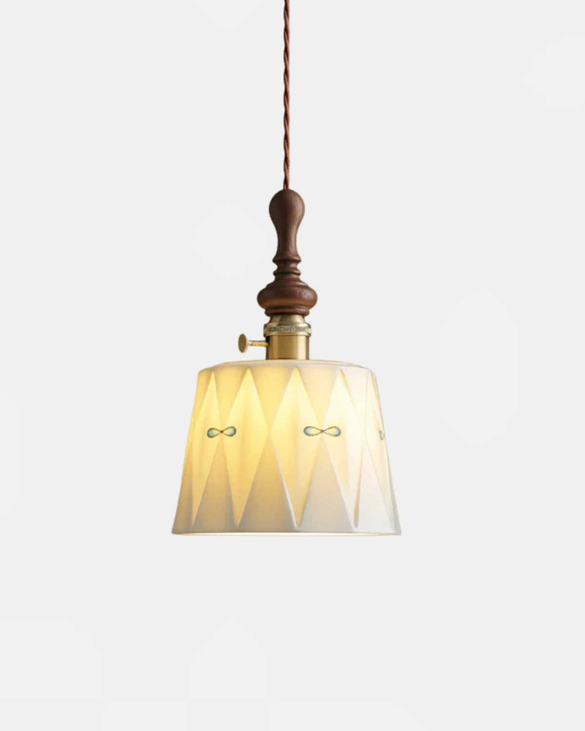 Ceramic pendant light MILA No.01 faceted porcelain shade with diamond pattern and walnut crown, switched on